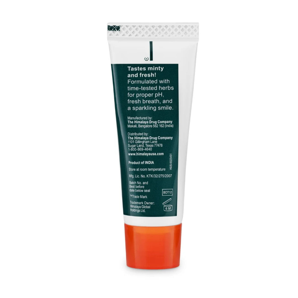 Back view of Himalaya Travel Size Toothpaste - Neem Pomegranate showcasing green and orange tube on white background