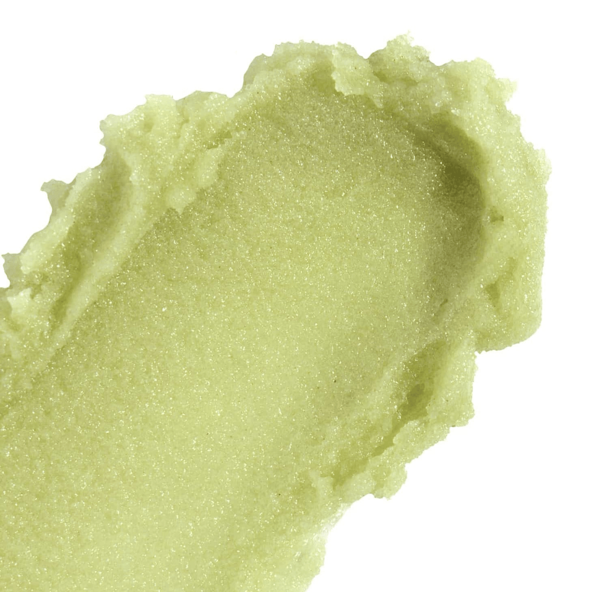 Close-up of Nopalera Bosque Mistico Body Polish showcasing its green, grainy texture on a white background