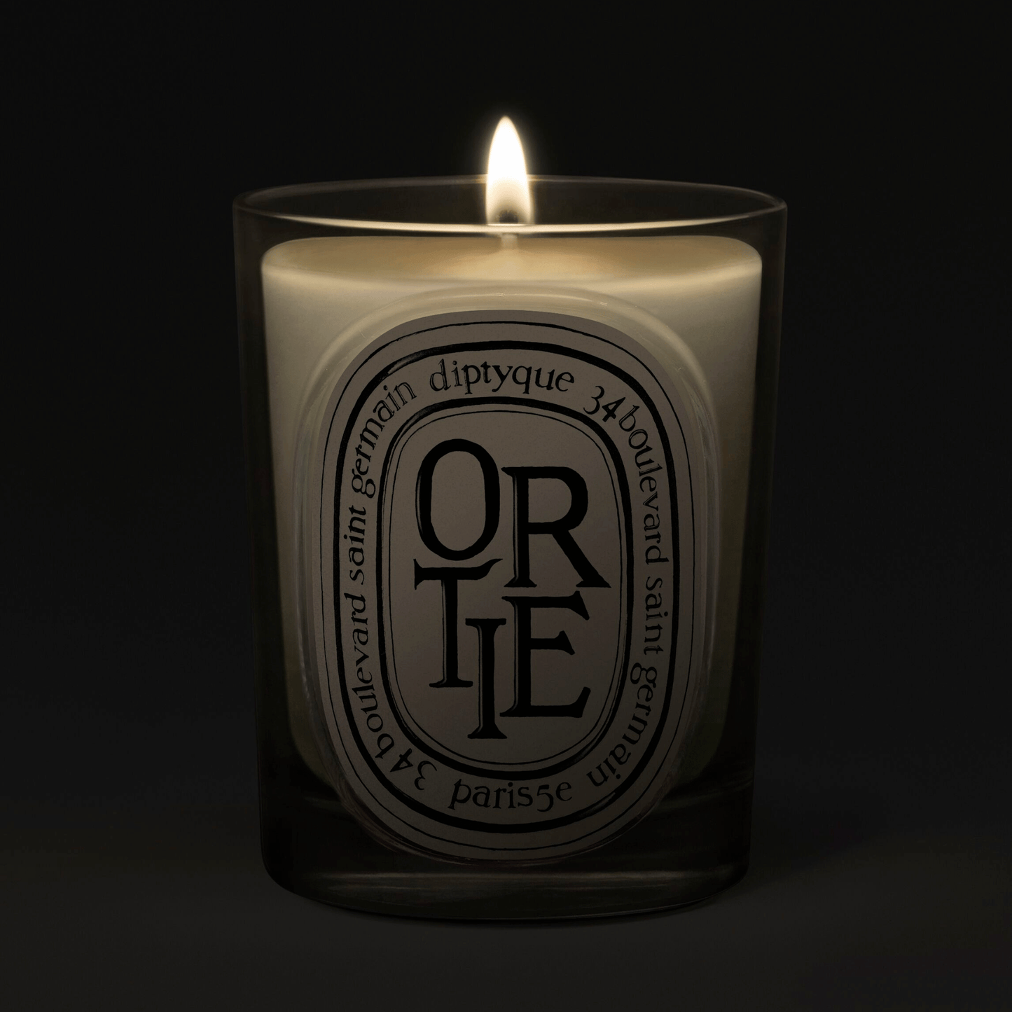 Alternate Image of Ortie Candle, clear glass vessel with black and white oval label