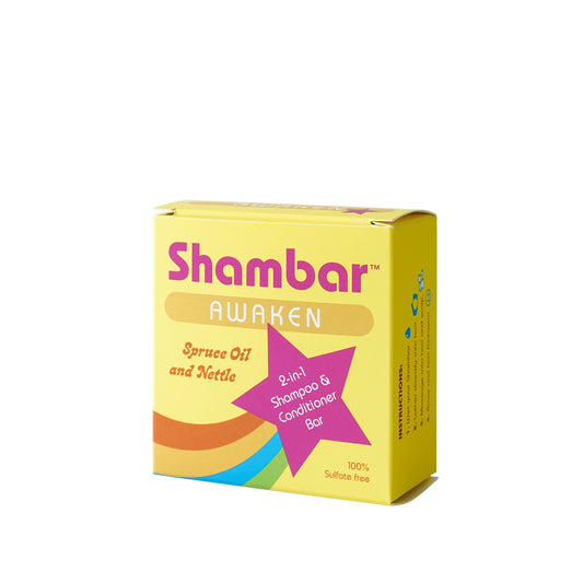 Front view of Shambar Awaken 2-in-1 shampoo and conditioner bar box with Spruce Oil and Nettle on white