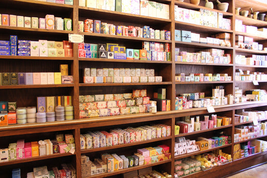 Shelves stocked with personal care and wellness products inside a retail apothecary