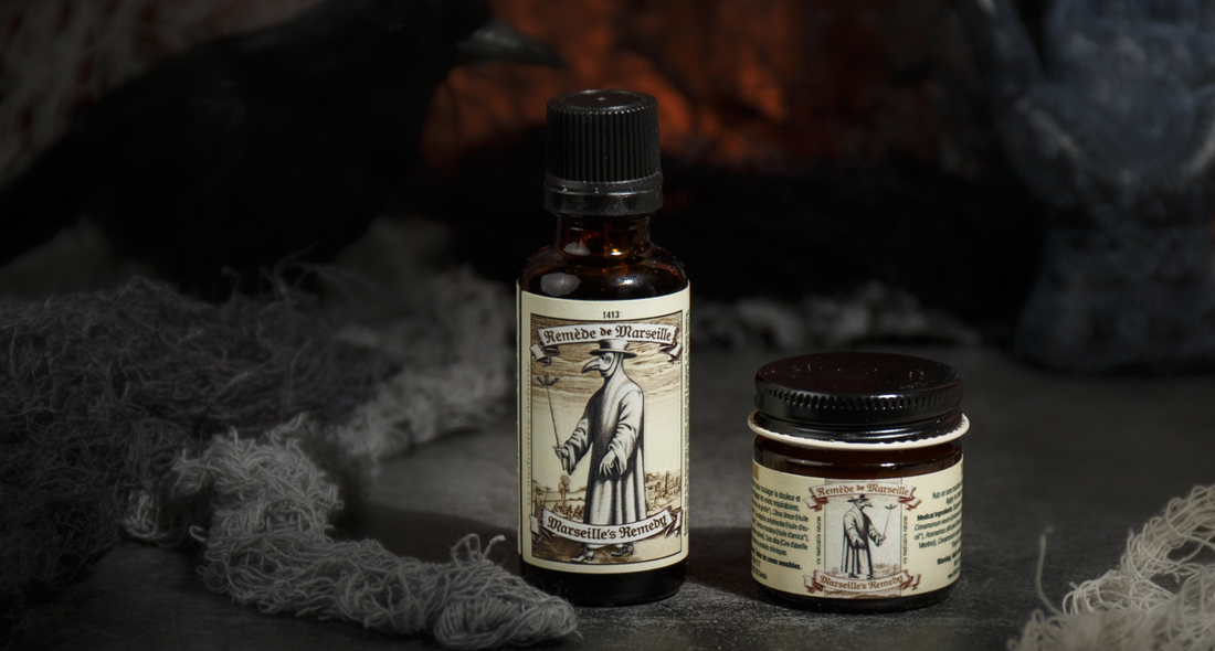 Marseille’s Remedy essential oil blend bottle and jar displayed in a spooky, smoke-filled setting