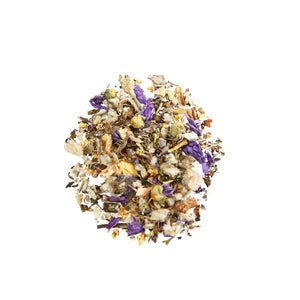 Top view of Breathe Free Respiratory Support Tea showcasing dried herbs and purple flowers on a white background