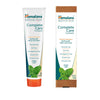 Front view of Himalaya Complete Care Simply Mint toothpaste tube and box with mint leaves on a white background
