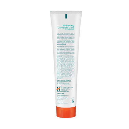 Back view of Himalaya Complete Care Simply Mint Toothpaste showing its label and orange cap on white