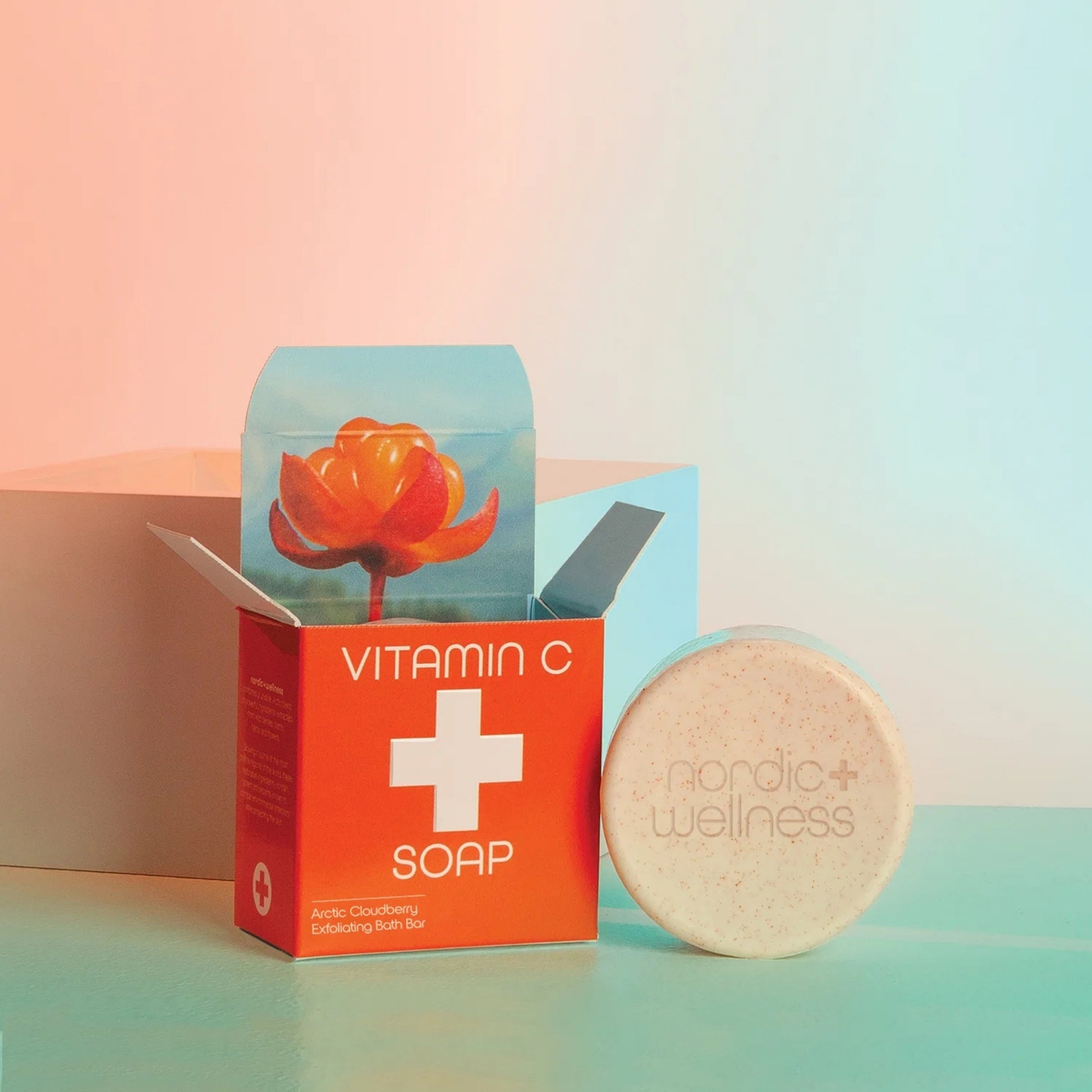 Front view of Kala Vitamin C Citrus Soap showcasing boxed packaging and a round soap bar on a colorful background