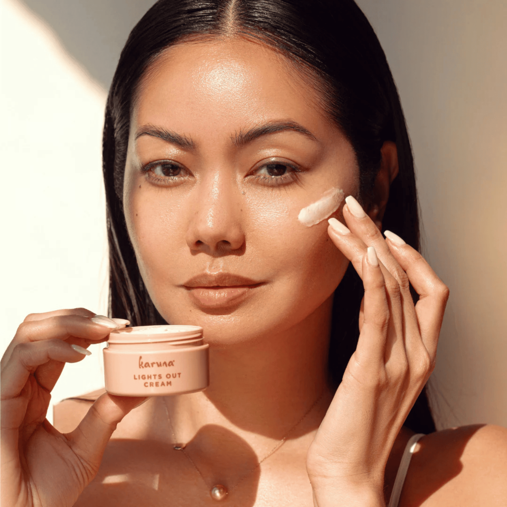 Alternate image Lights Out Cream, Opened pink jar and cream on model