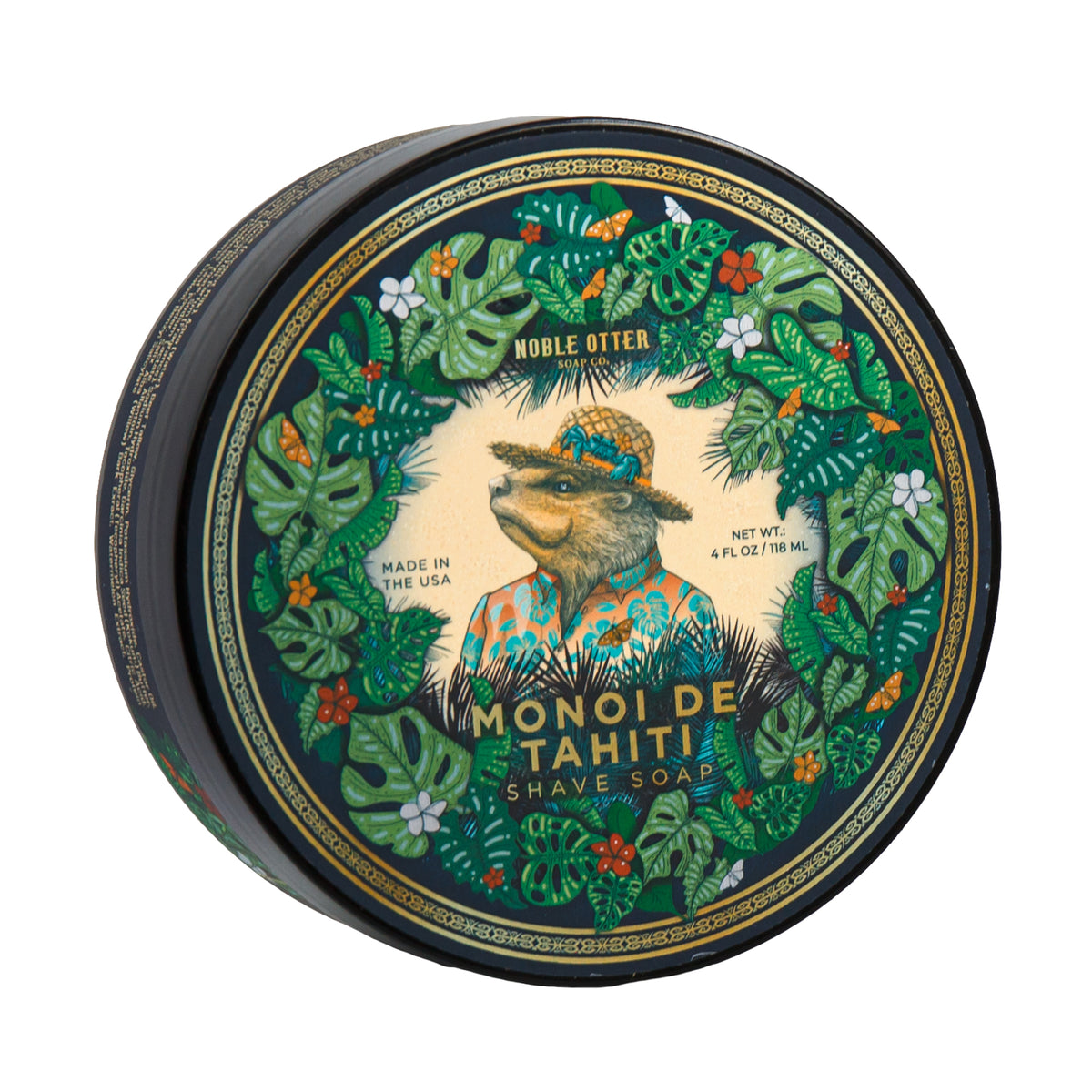 Top view of Noble Otter Monoi De Tahiti shaving soap showcasing an ornate botanical tin design with a white background