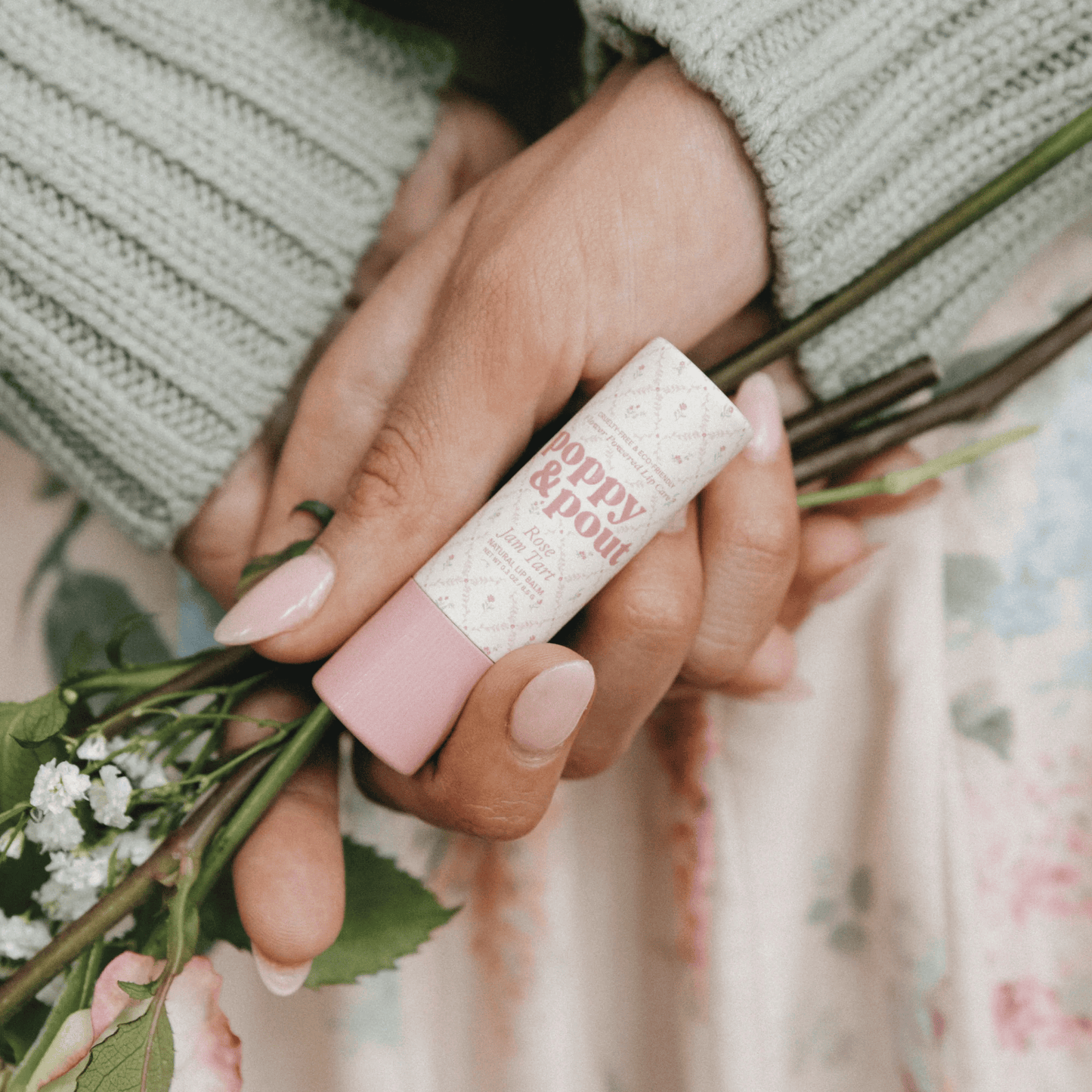 Hand image of Poppy & Pout Rose Jam Tart Cottage Collection Lip Balm