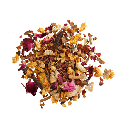 Close-up of Spiced Rose Rooibos Tea showcasing loose tea leaves and rose petals on a white background