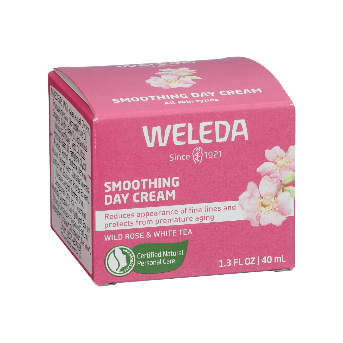 Front three quarter view of Weleda Smoothing Day Cream box showcasing wild rose and white tea, 40 ml size, on white background