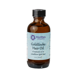 Front view of Goldilocks Hair Oil bottle showcasing an amber bottle and black cap on a white background