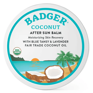Front view of Badger Coconut After Sun Balm Tin showcasing a turquoise label and tropical beach illustration