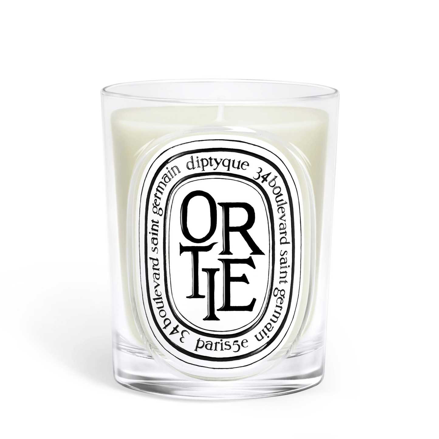 Primary Image of Ortie Candle, clear glass vessel with black and white oval label