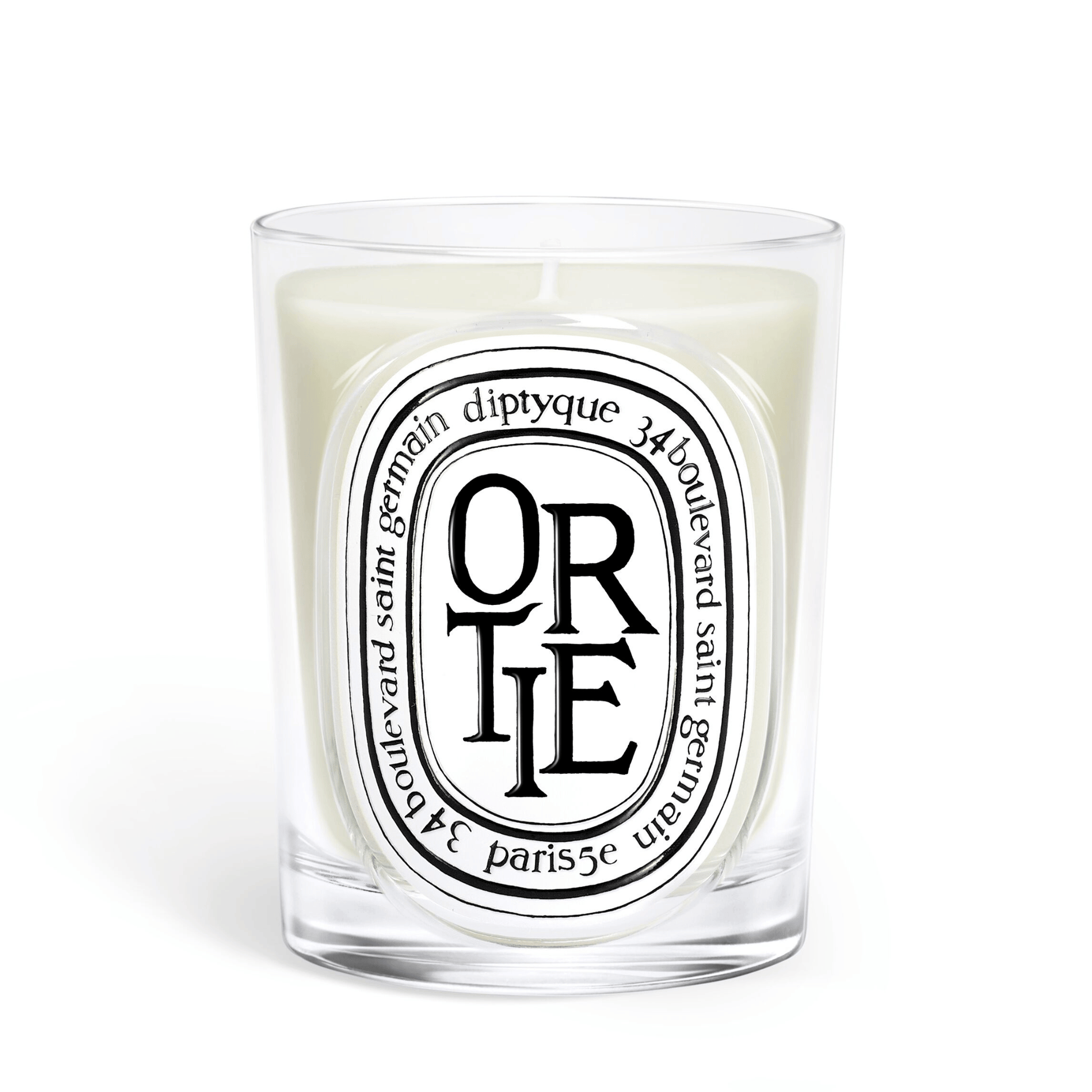 Primary Image of Ortie Candle, clear glass vessel with black and white oval label