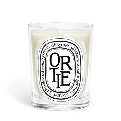 Primary Image of Ortie Candle, clear glass vessel with black and white oval label