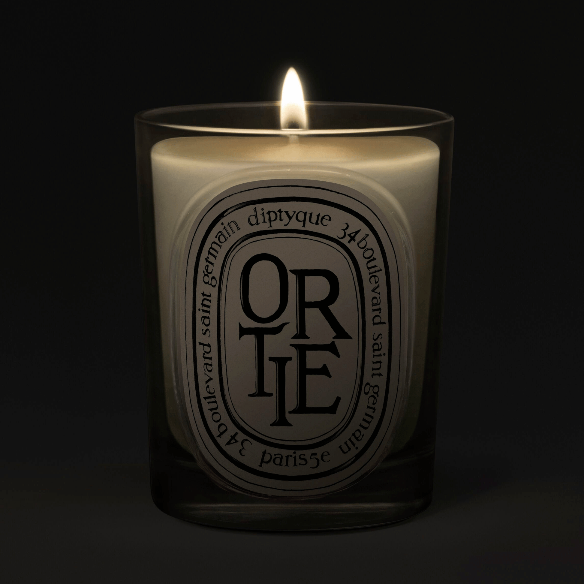 Alternate Image of Ortie Candle, clear glass vessel with black and white oval label