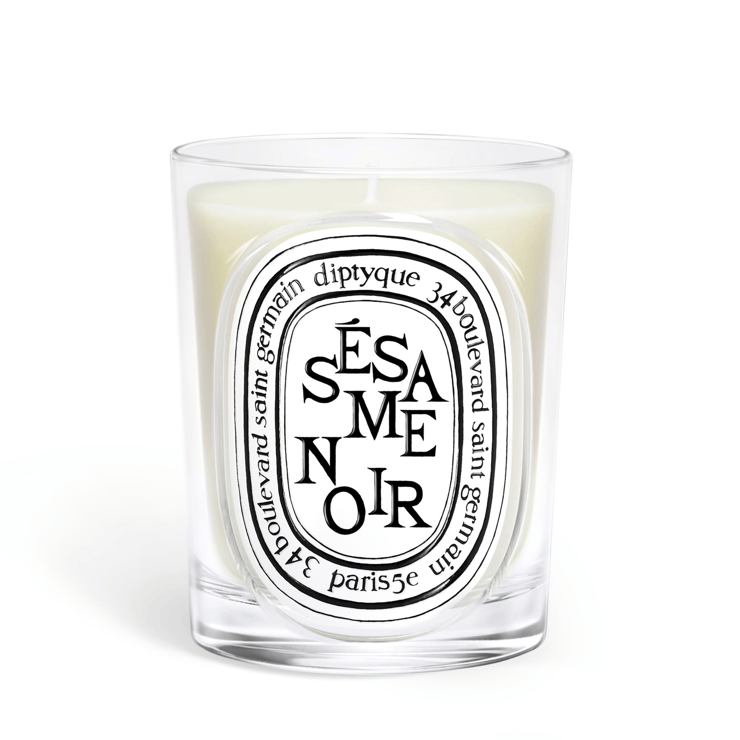Primary Image of Sesame Noir Candle, clear glass vessel with black and white oval label