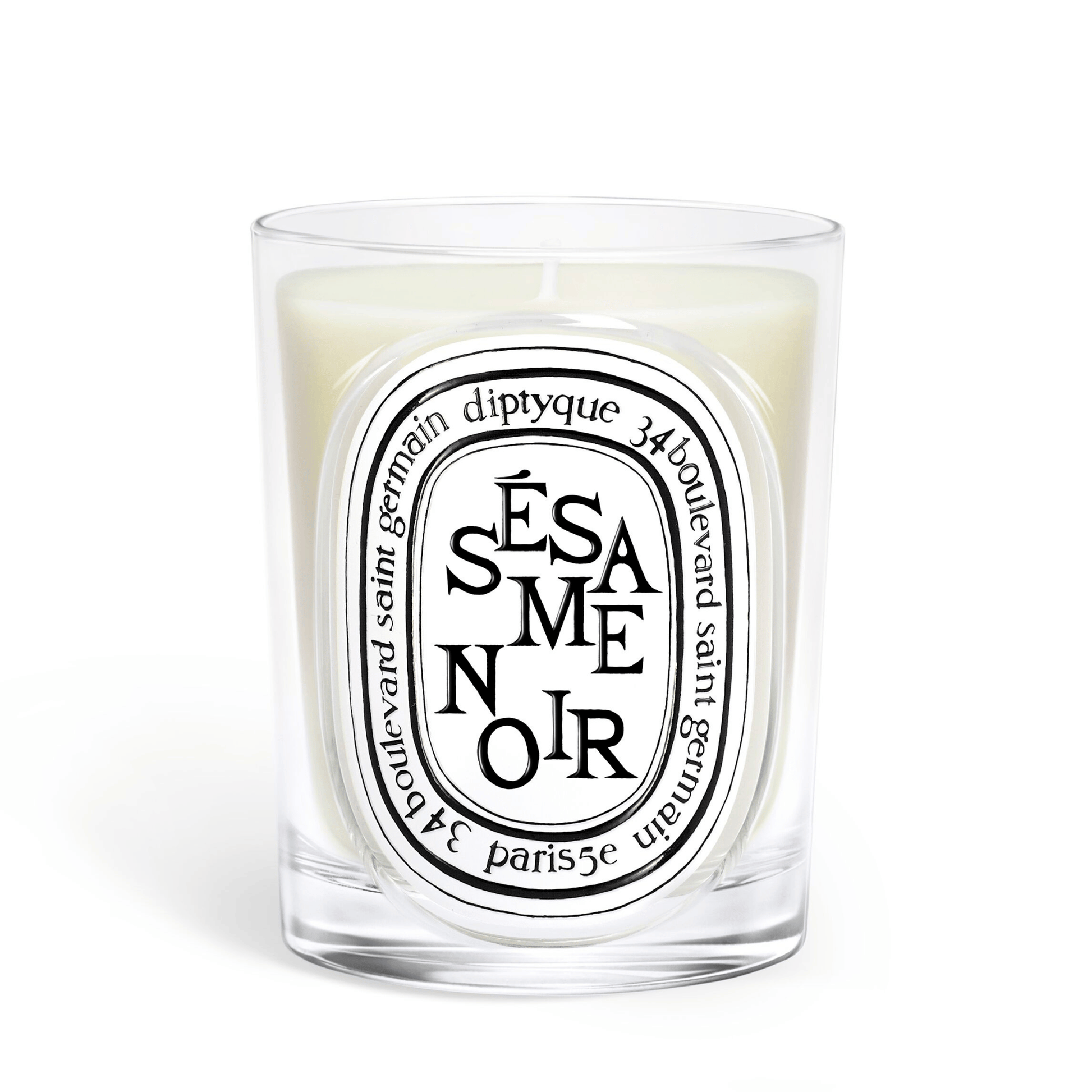 Primary Image of Sesame Noir Candle, clear glass vessel with black and white oval label