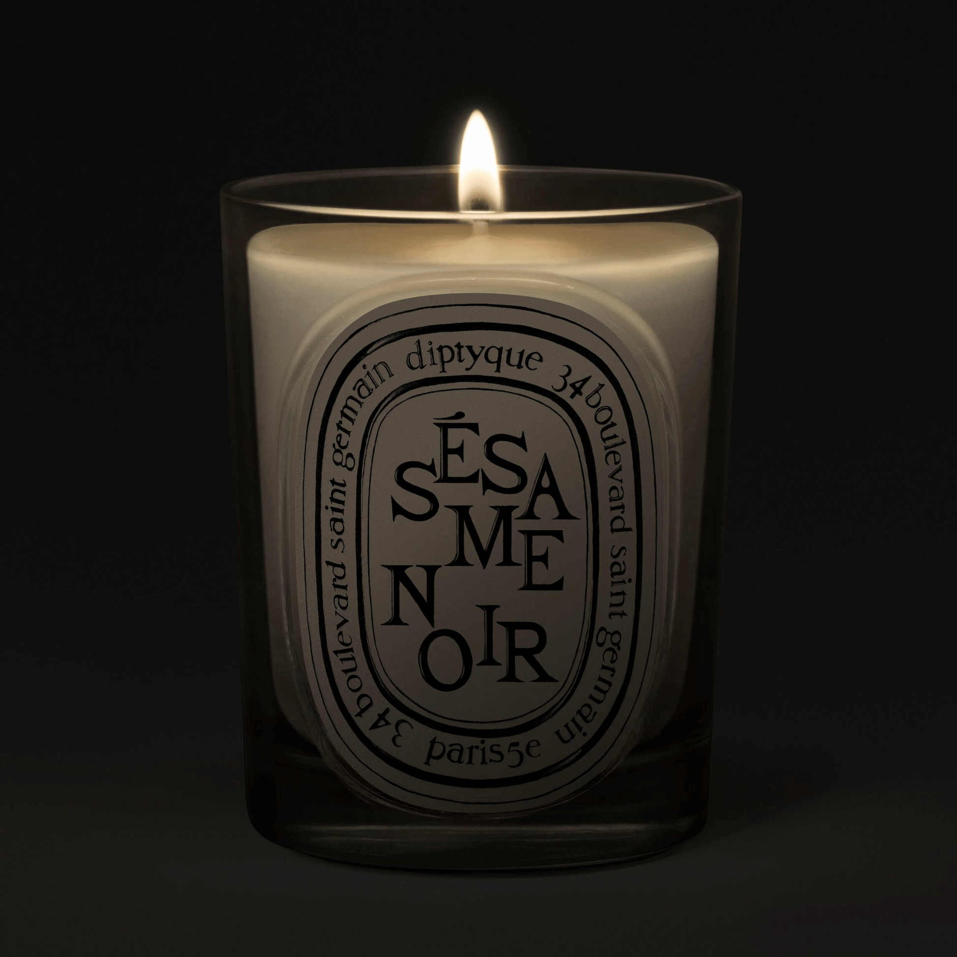 Alternate Image of Sesame Noir Candle, clear glass vessel with black and white oval label