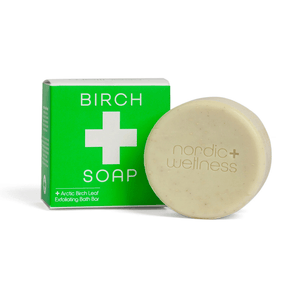 Front view of Kala Nordic Wellness Arctic Birch Soap showcasing a beige round bar beside a green Birch Soap box