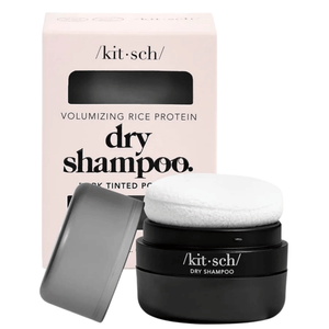 Front view of Kitsch dark tinted volumizing dry shampoo puff showcasing black jar, gray lid, and white puff on white background