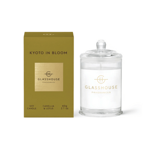 Front view of Glasshouse Kyoto In Bloom Votive Candle showcasing a glass jar and gold box with white background