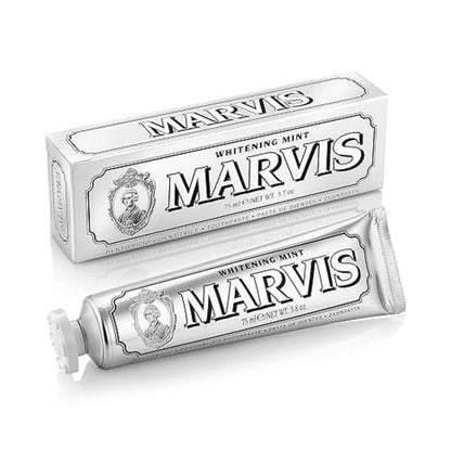 Front view of Marvis Whitening Mint Toothpaste showing a silver tube and matching box on a white background