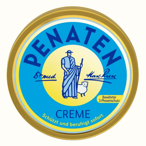 Top view of Penaten Baby Creme tin showcasing blue and yellow lid with illustrated figure and sheep on a white background