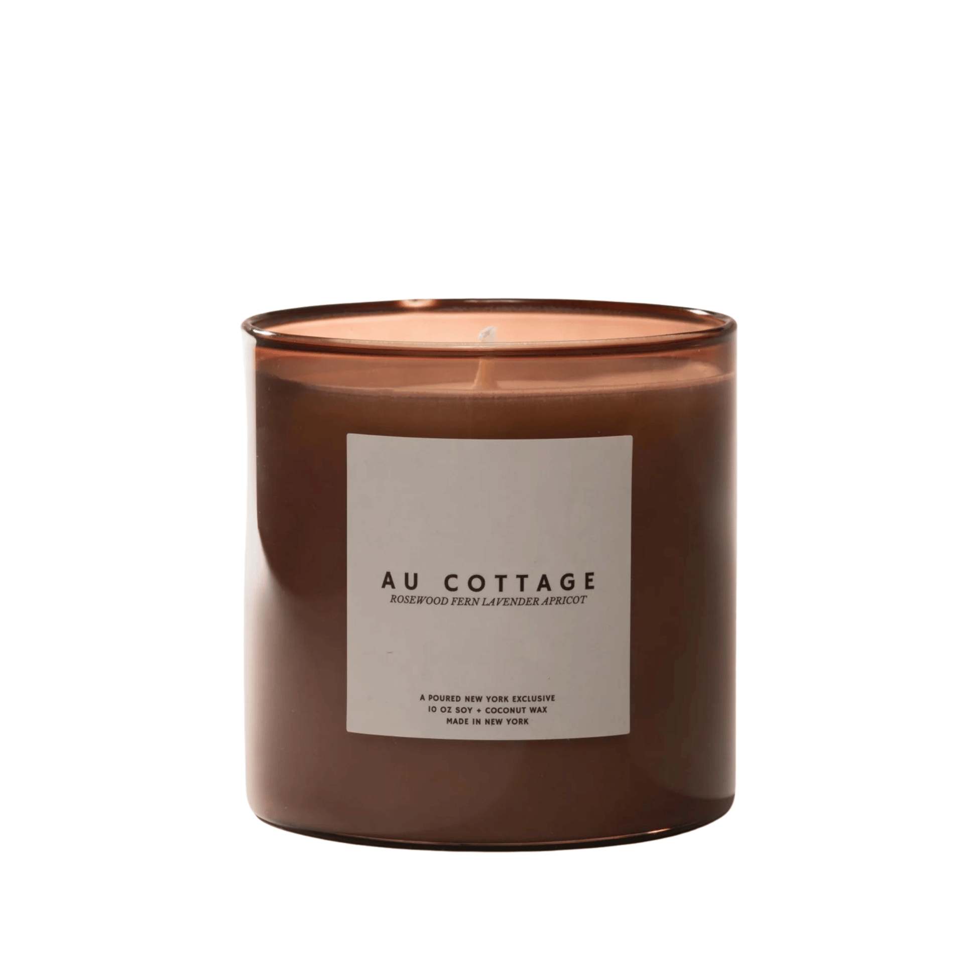 Primary Image of Au Cottage Candle, soft brown glass candle with white label