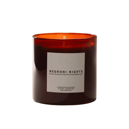Primary Image of Negroni Nights Candle, dark red glass candle vessel with white label