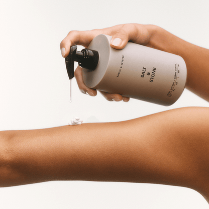 Alternate Image of Salt & Stone Body Lotion, round body lotion bottle with pump dispensing on skin