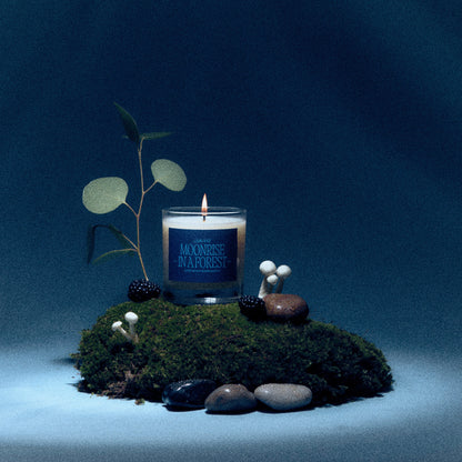 Alternate Image of Moonrise in a Forest Candle, candle with dark label in a moody forest setting