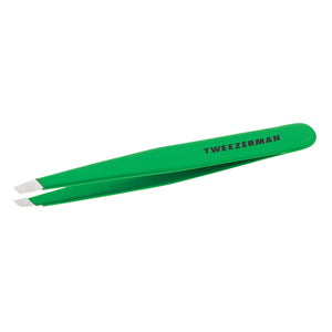 Side view of Tweezerman Green Apple Slant Tweezer showcasing angled tips and green finish with a white background