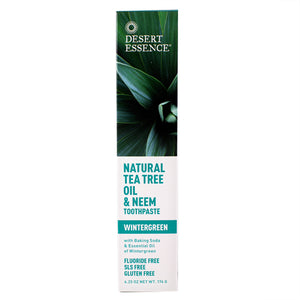 Front view of Tea Tree Oil Neem Toothpaste showcasing green packaging with a Wintergreen label on a white background