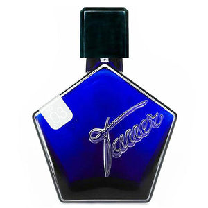 Front view of Imaginary Authors Yesterday Haze Eau de Parfum bottle showcasing blue geometric glass with black cap on white background