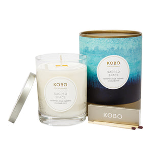 Front view of Sacred Space Watercolor Candle showcasing its glass jar, watercolor tin, lid, and matches on a white background